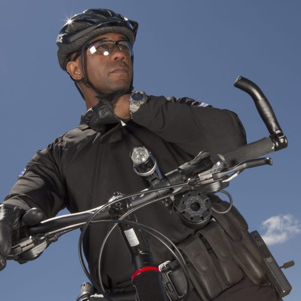 EMERGENCY SERVICES - Airport Bike Police looking at camera.